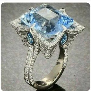 Aquamarine flower shaped with white sapphires  on .925 sterling silver sz9